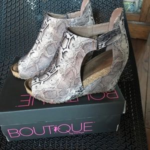 Worn once!  Boutique by Corkys snake print wedges.  Comfy and super cute.